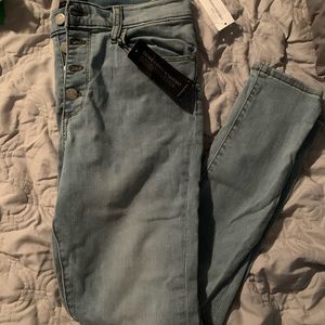 Button fly skinny jeans